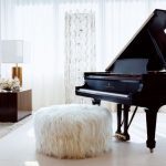 wooly ottoman next to a piano