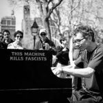 Colin Huggins plays at Washington Square