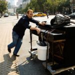 Rolling an upright piano on the streets of New York