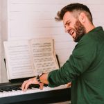 pianist testing the piano tuning